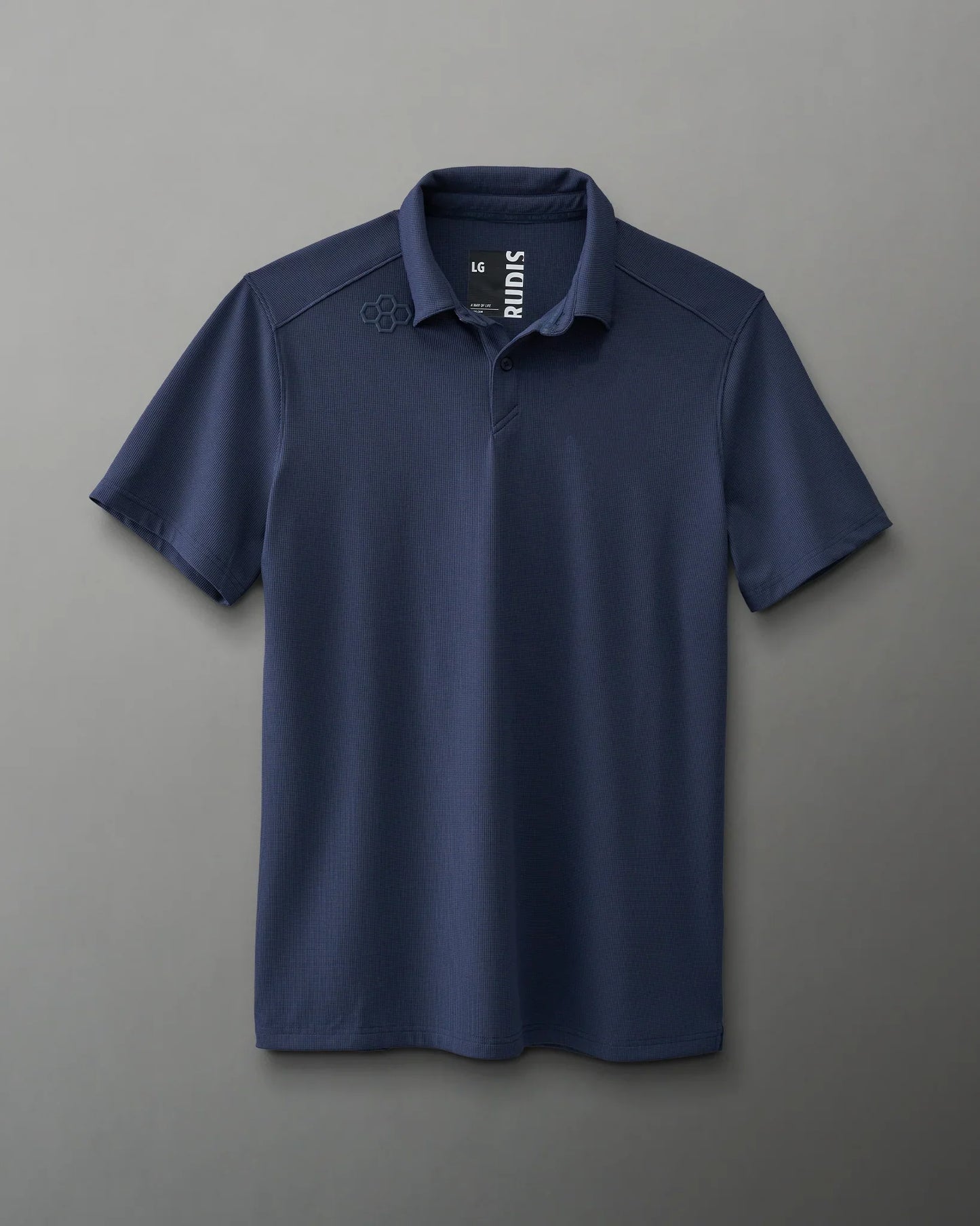 A navy blue polo shirt with textured fabric and a small logo, featuring a classic collar and three-button placket, suitable for casual or semi-formal wear.