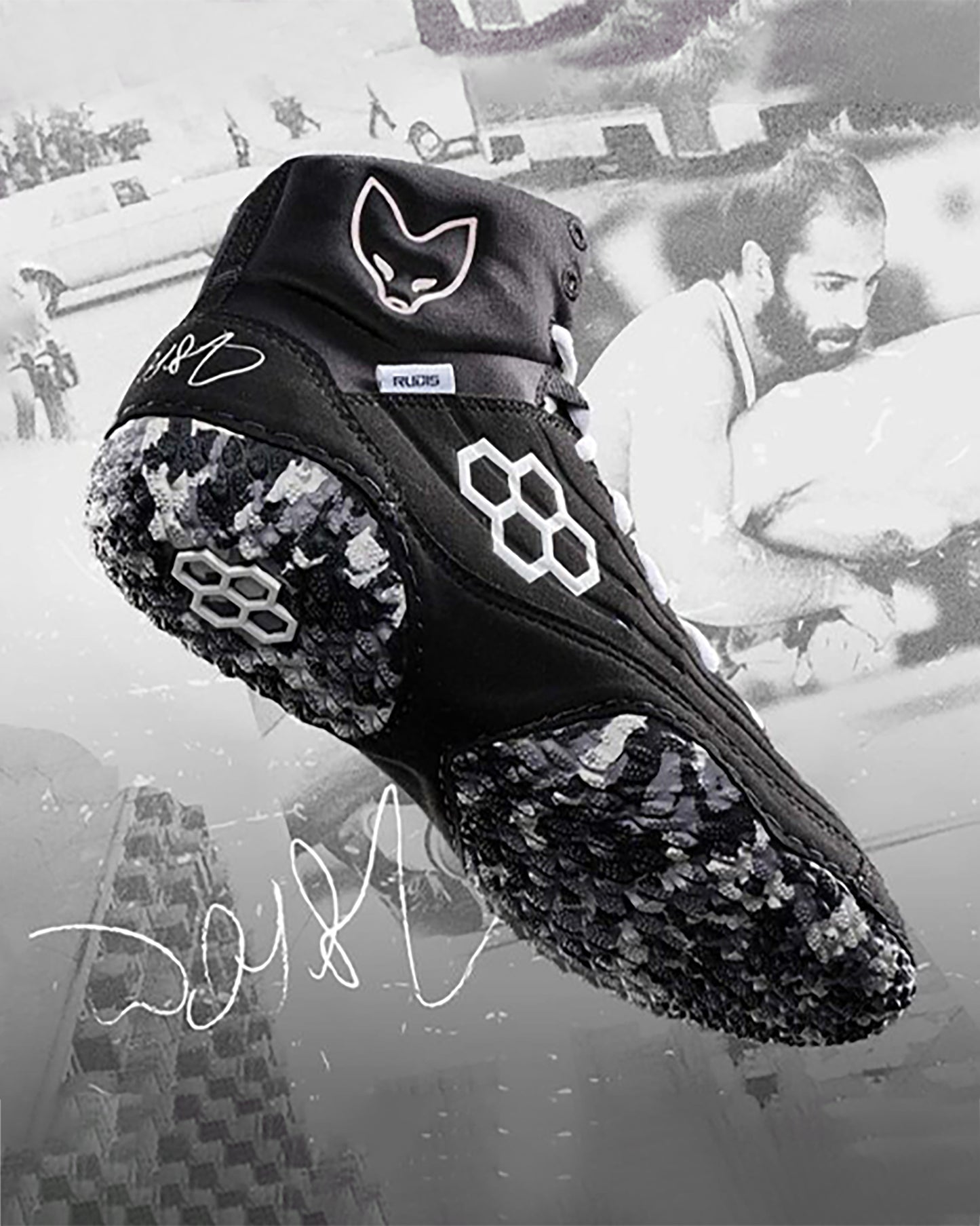 A black athletic shoe showcasing a unique design with a fox logo and a textured sole highlighted against a monochromatic background with subtle imagery of athletes in action