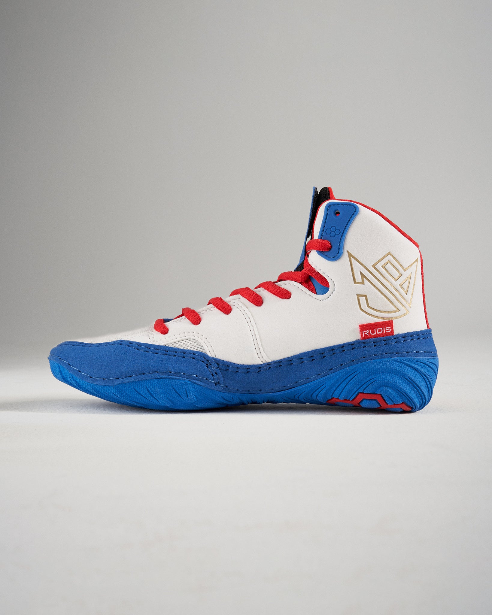 This image depicts a high-top athletic shoe predominantly white with blue and red accents designed for performance and style