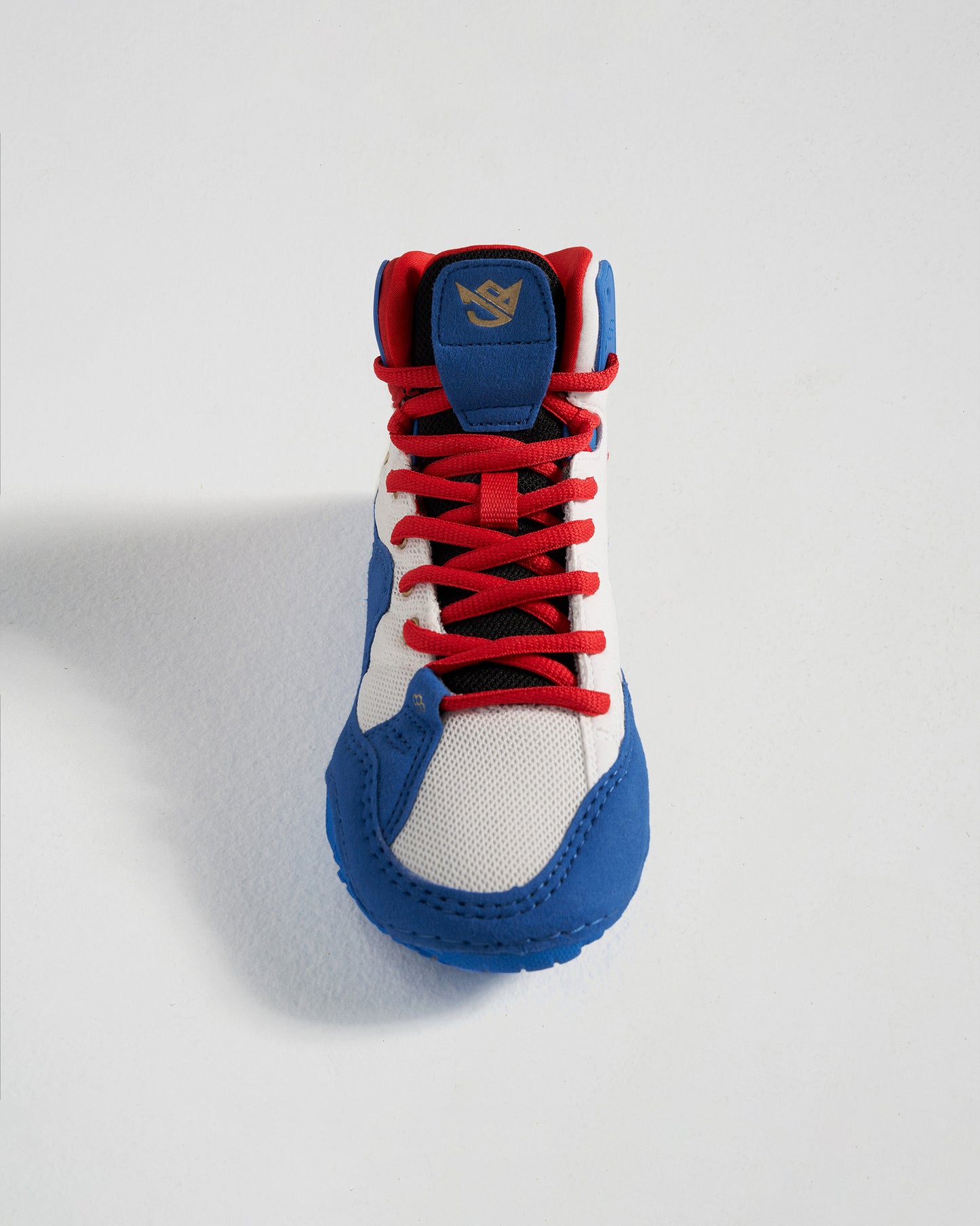 A stylish high-top sneaker featuring a vibrant combination of blue red and white colors designed for both comfort and fashion