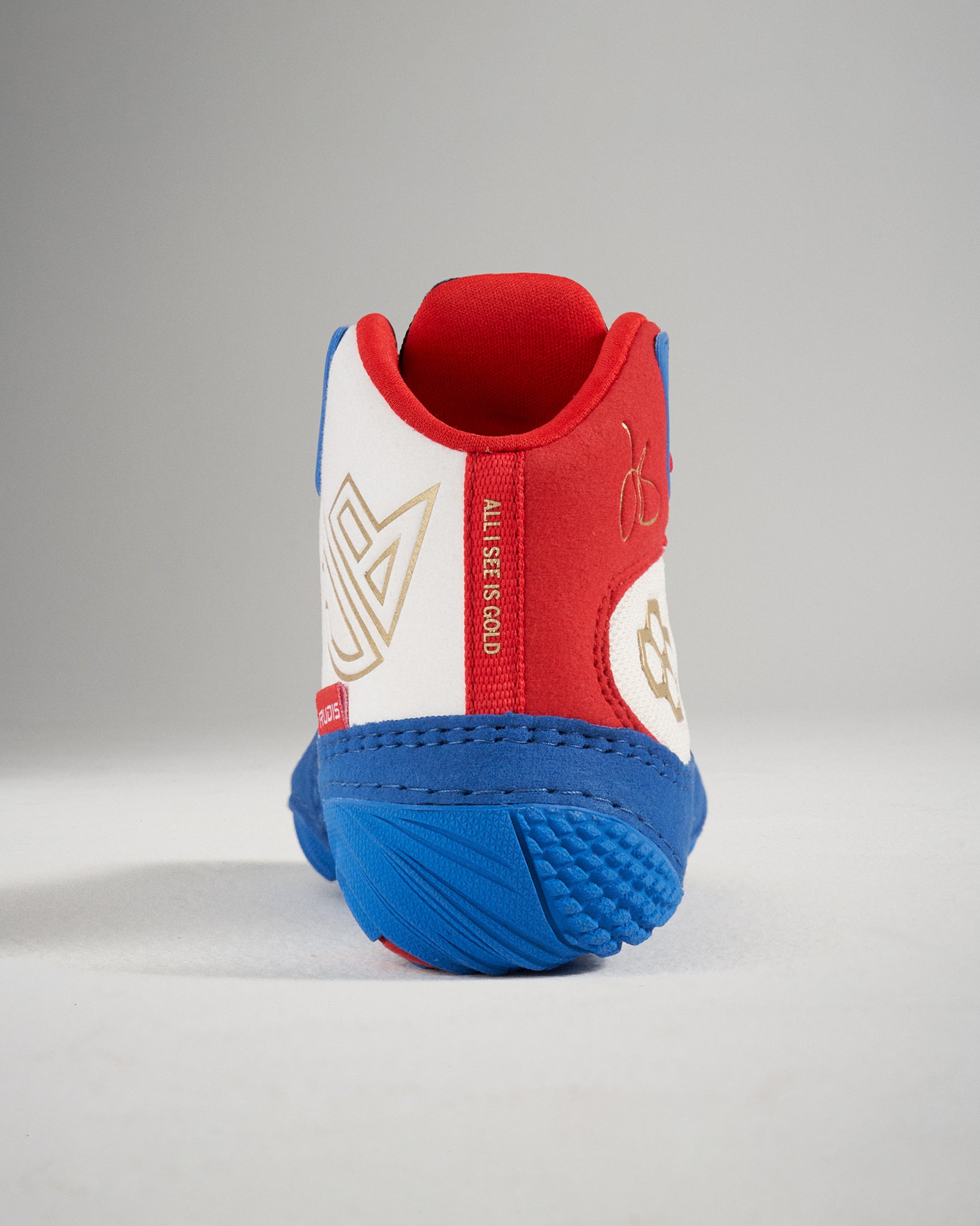 A vibrant pair of red white and blue athletic shoes designed for active performance showcasing unique design elements and textures