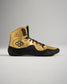 A stylish pair of gold and black athletic shoes with a high-top design featuring a unique hexagonal logo and intricate lacing system for added support