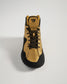 A stylish high-top sneaker in a striking gold and black color scheme featuring a robust design and a textured sole for traction