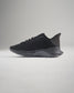 A sleek black running shoe featuring a breathable mesh upper and a durable textured sole designed for optimal performance and style