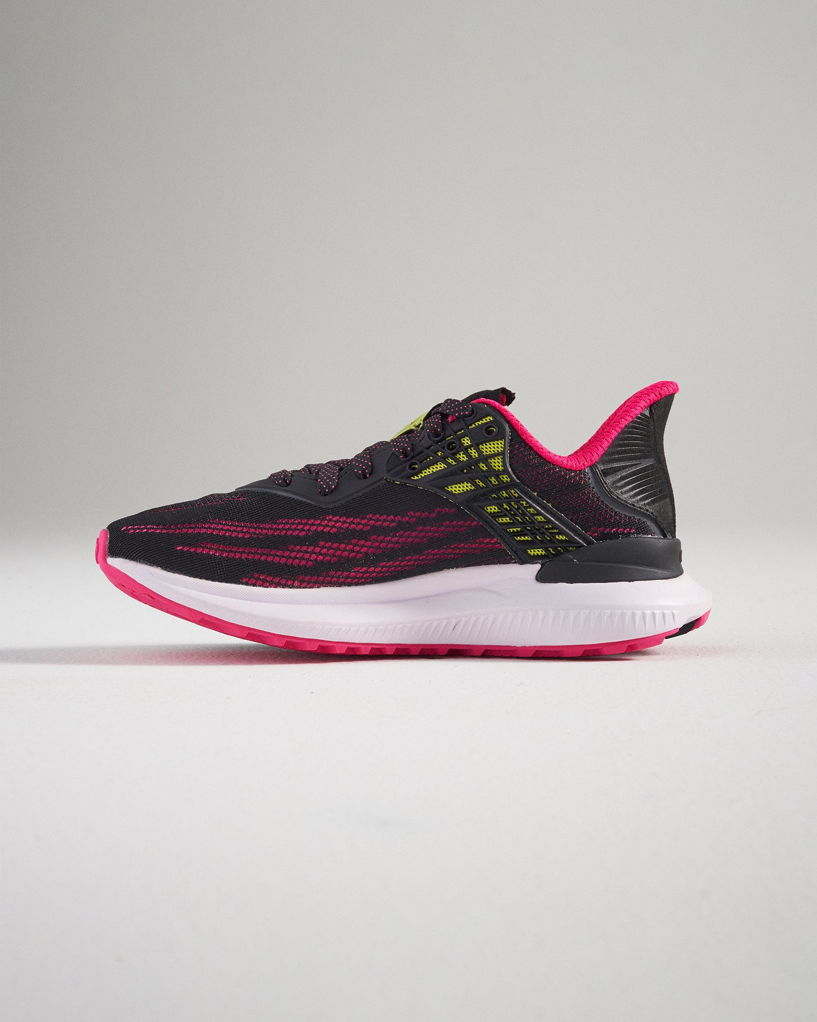 A pair of modern black running shoes featuring vibrant pink and yellow accents with a breathable mesh upper and a cushioned sole