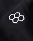 An embroidered white hexagonal pattern on a black garment highlighting a stylish and modern design