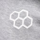 A close-up view of a grey fabric featuring a white hexagonal logo design highlighting the texture and pattern