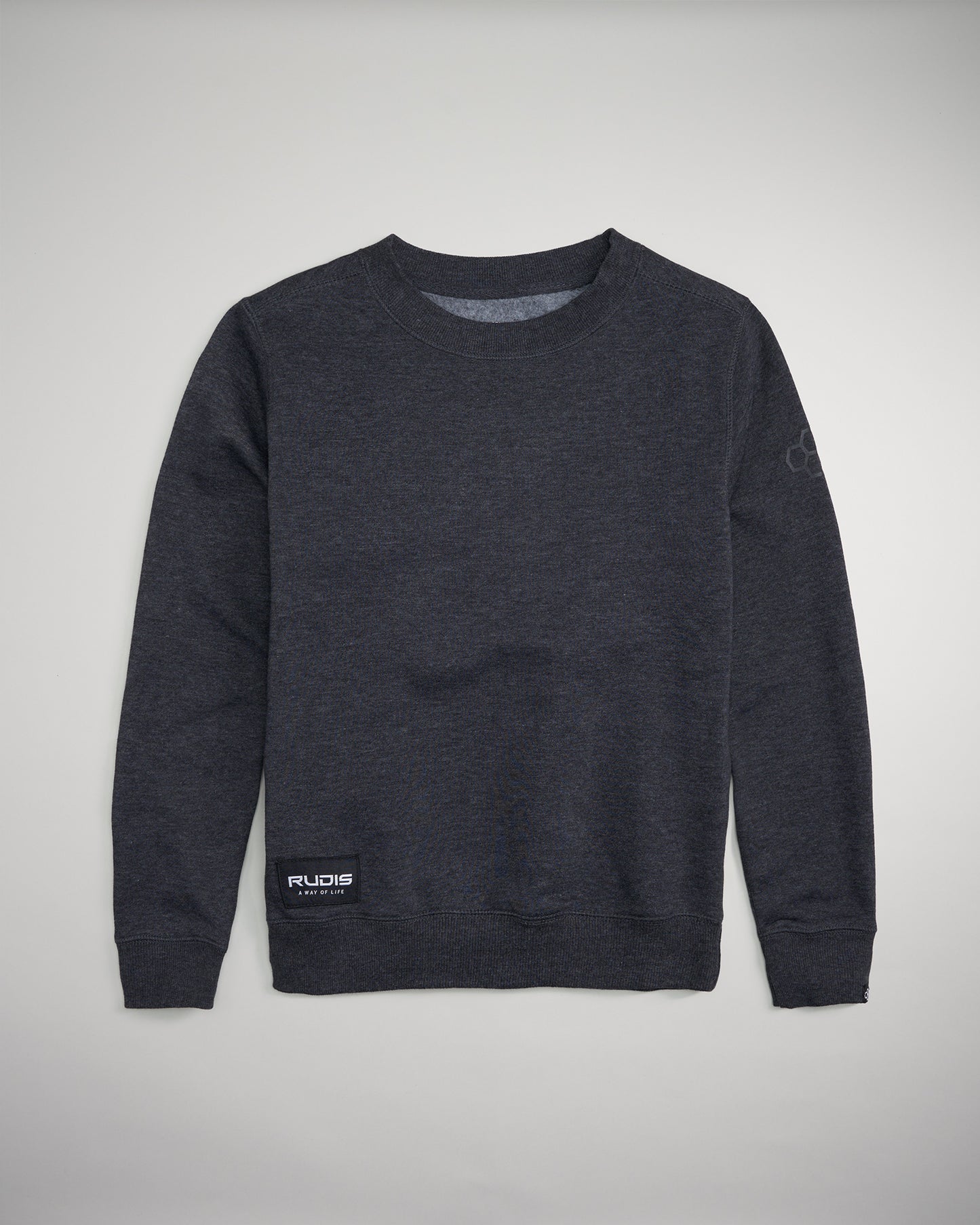 A sleek dark gray sweatshirt with ribbed cuffs and a simple crew neck design featuring a branded patch at the hem and an emblem on the sleeve