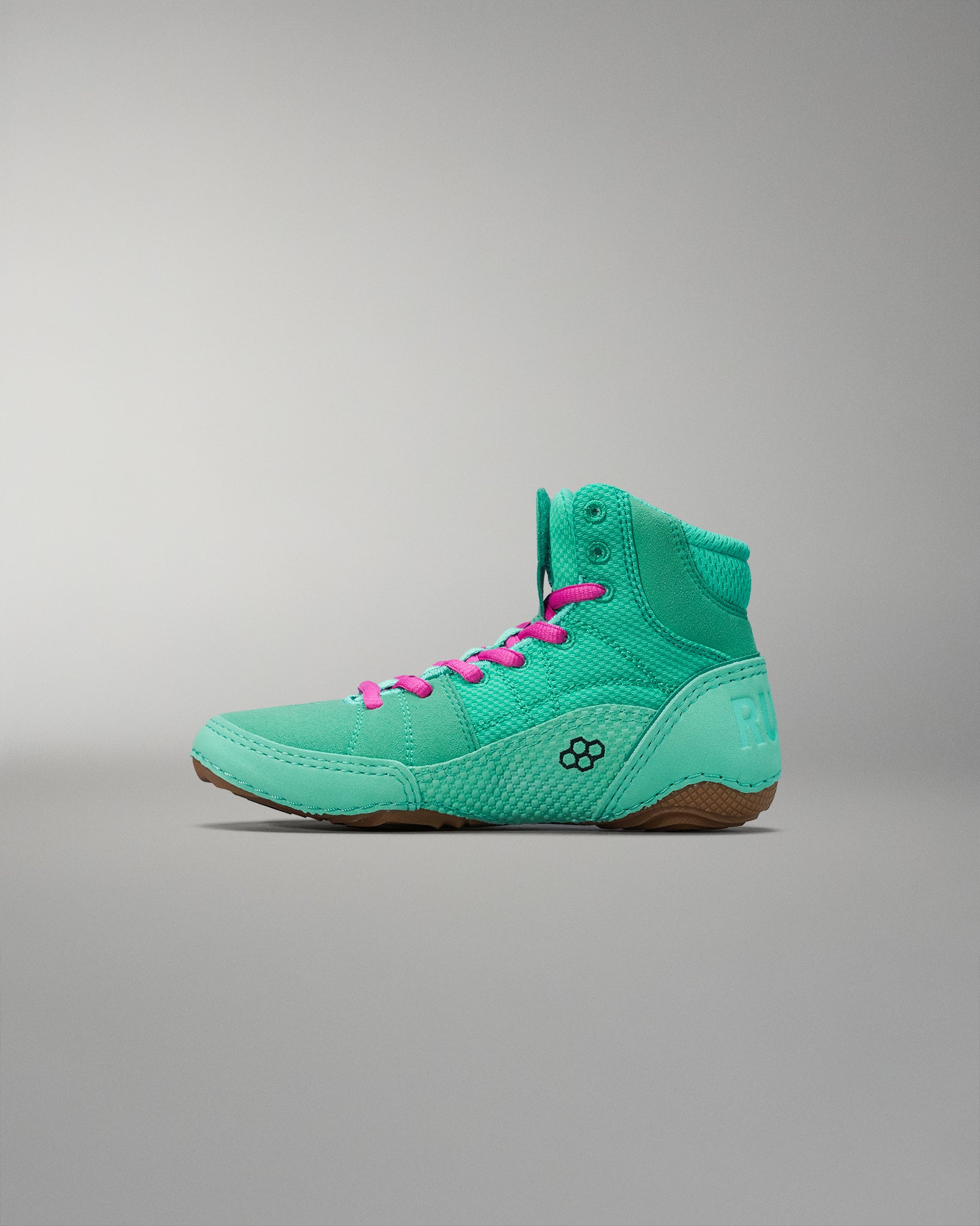 High-top athletic shoe in vibrant teal with pink laces and textured fabric, featuring a padded collar for comfort against a soft gray background.