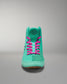 High-top shoe in vibrant turquoise with contrasting pink laces and a black logo on the tongue, designed for casual or athletic use.