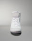 High-top white shoe with a textured upper and Velcro strap, showcasing a minimalist design against a smooth gradient background.