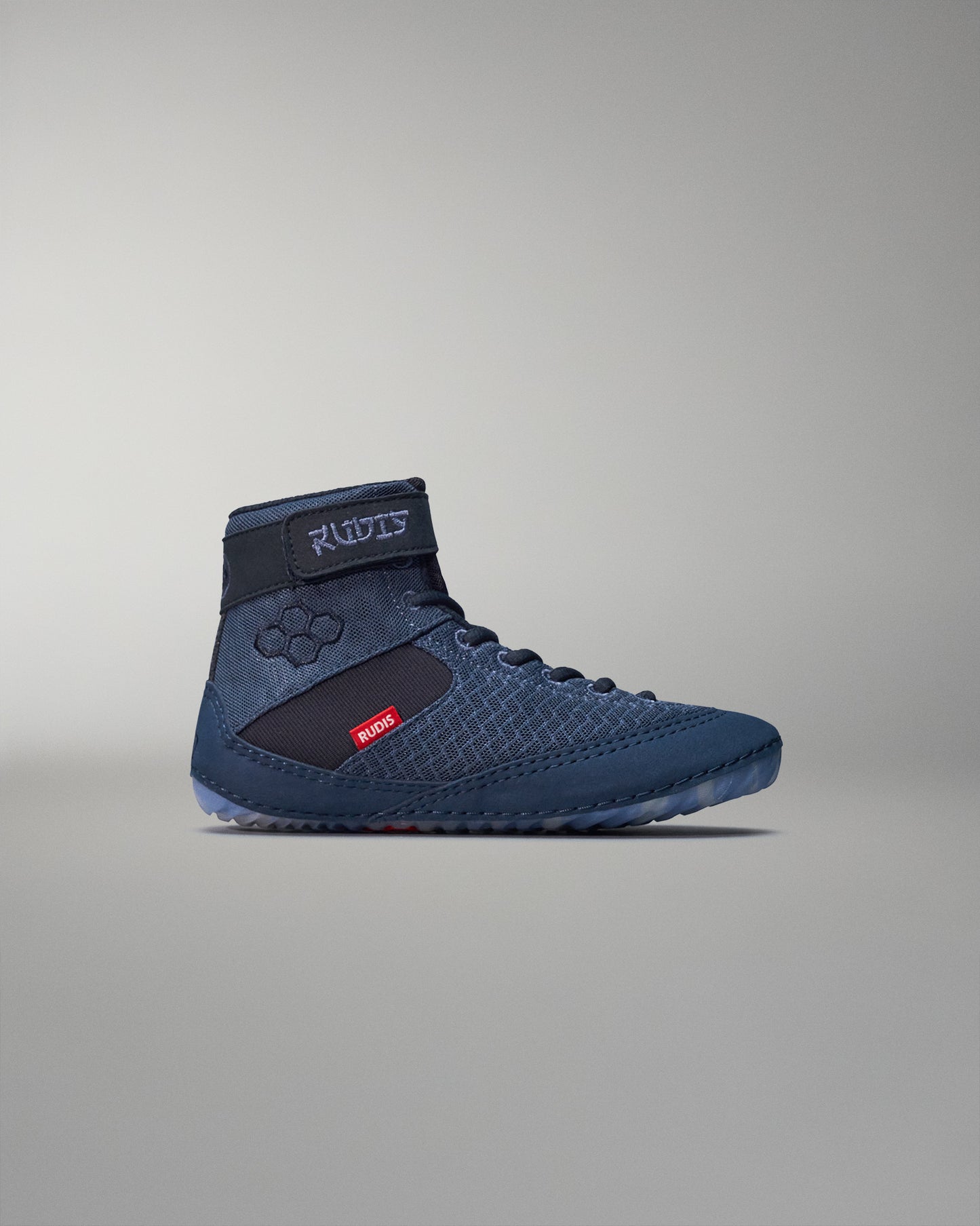 High-top wrestling shoe with a navy blue mesh upper and black ankle strap for support, featuring a textured sole for grip and a red 'RUDIS' tag.