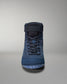 A high-top shoe with a dark blue fabric upper, reinforced stitching, and a textured rubber sole for traction.