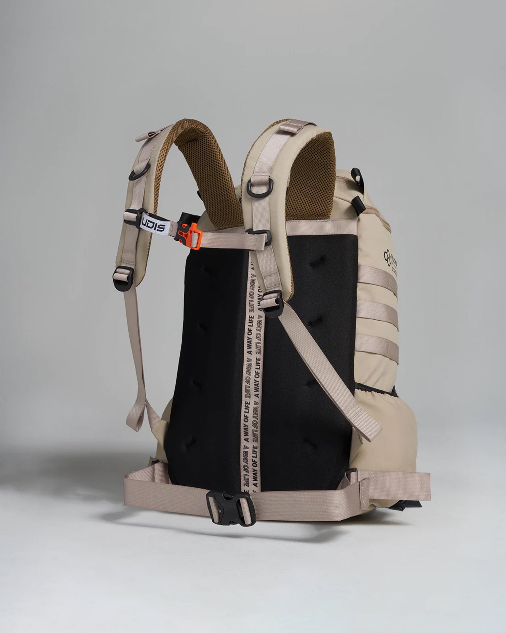 A sleek modern two-tone backpack featuring a beige body with black accents adjustable straps and a unique design emphasizing comfort and functionality